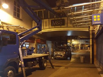 Cherry picker parked in street completing high level work